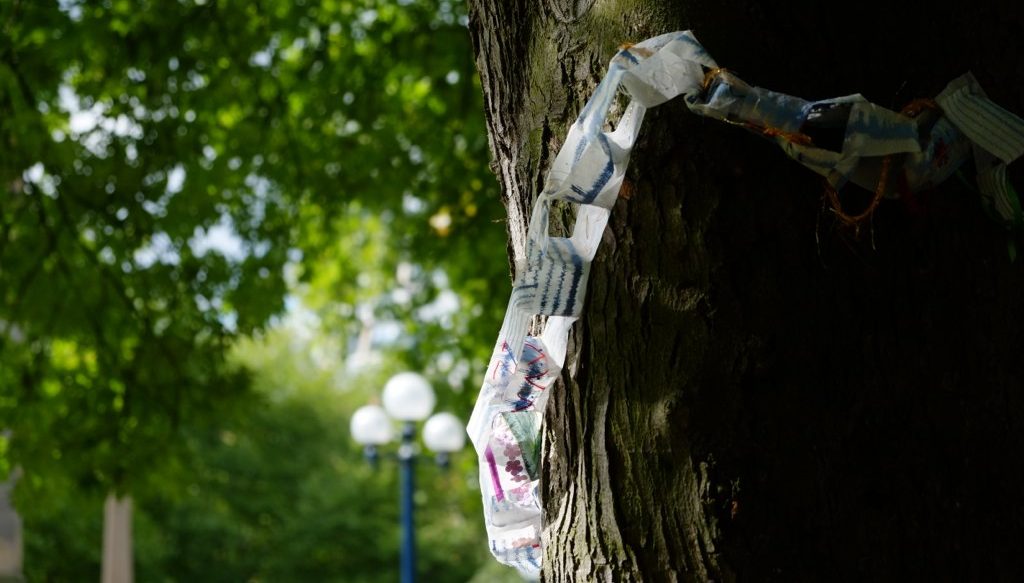 the colorful chain made of fabric strips was hung up at the tree