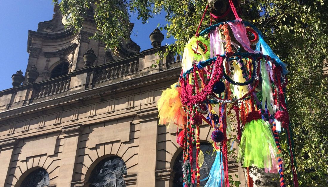 The large-scale brightly coloured chandelier was hung up in the tree in front of the Cathedral
