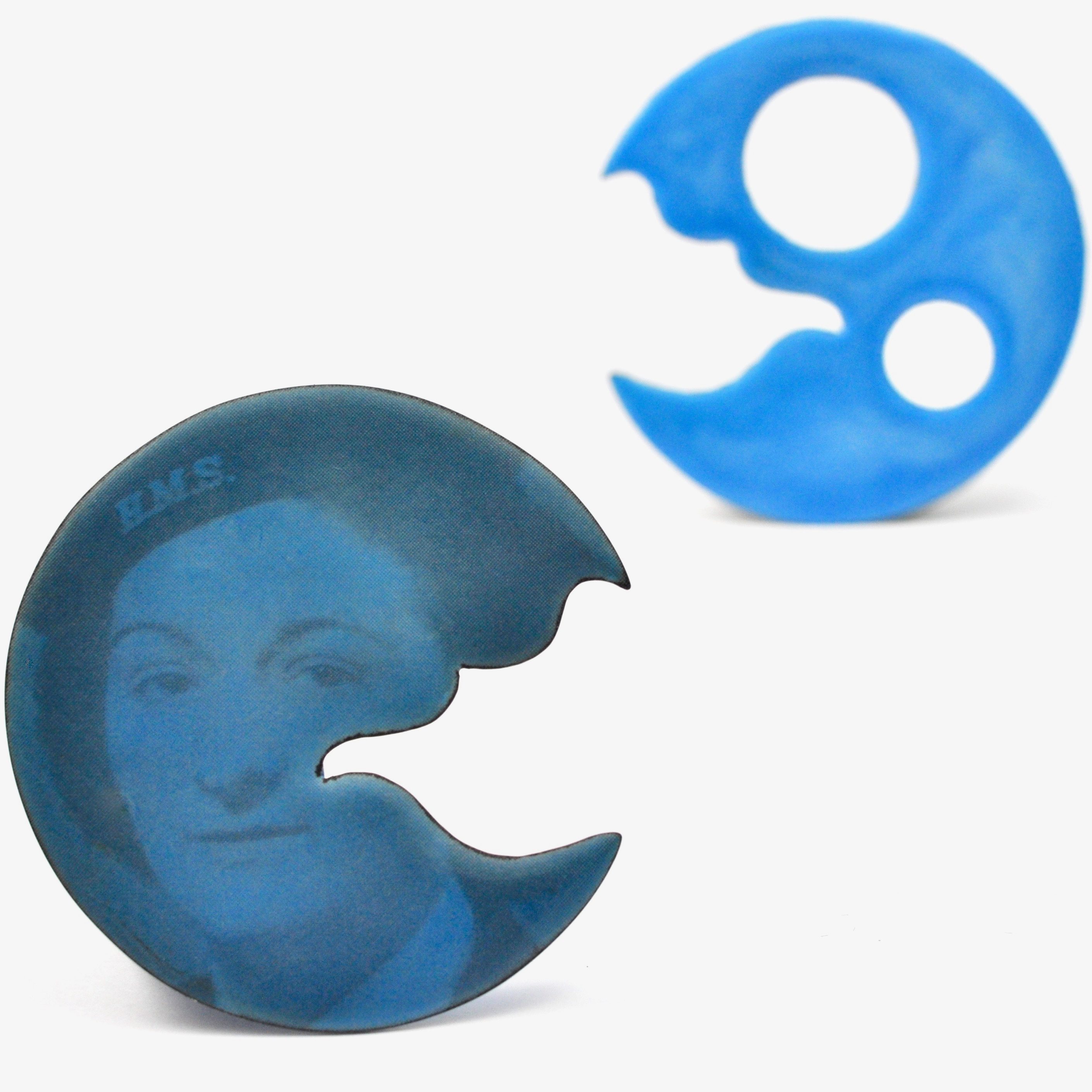 Blue enamelled jewellery with a old fashioned picture of a face.
