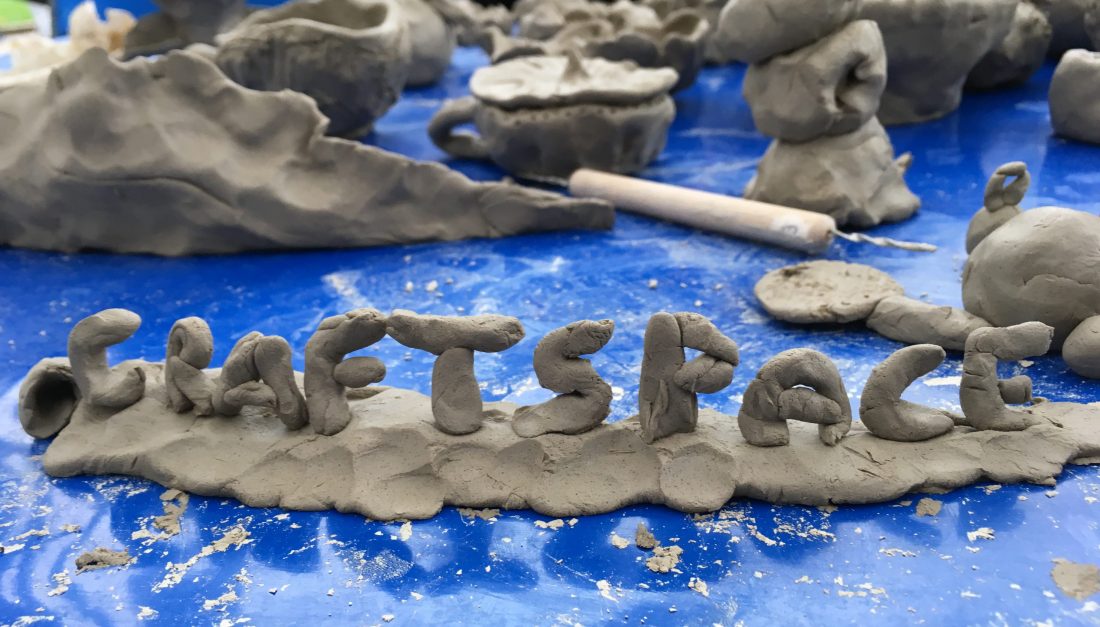 The word CRAFTSPACE sculpted from clay.