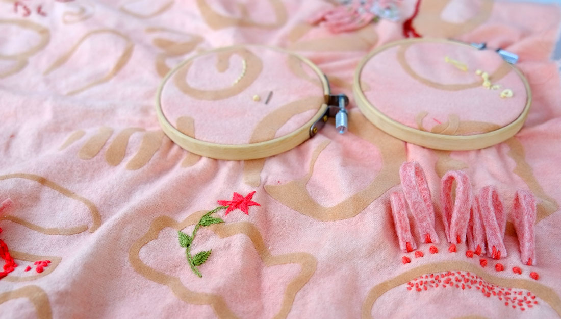 embroidery and embroidery hoops on a soft piece of material