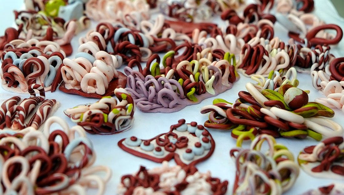 a series of small polymer clay loops